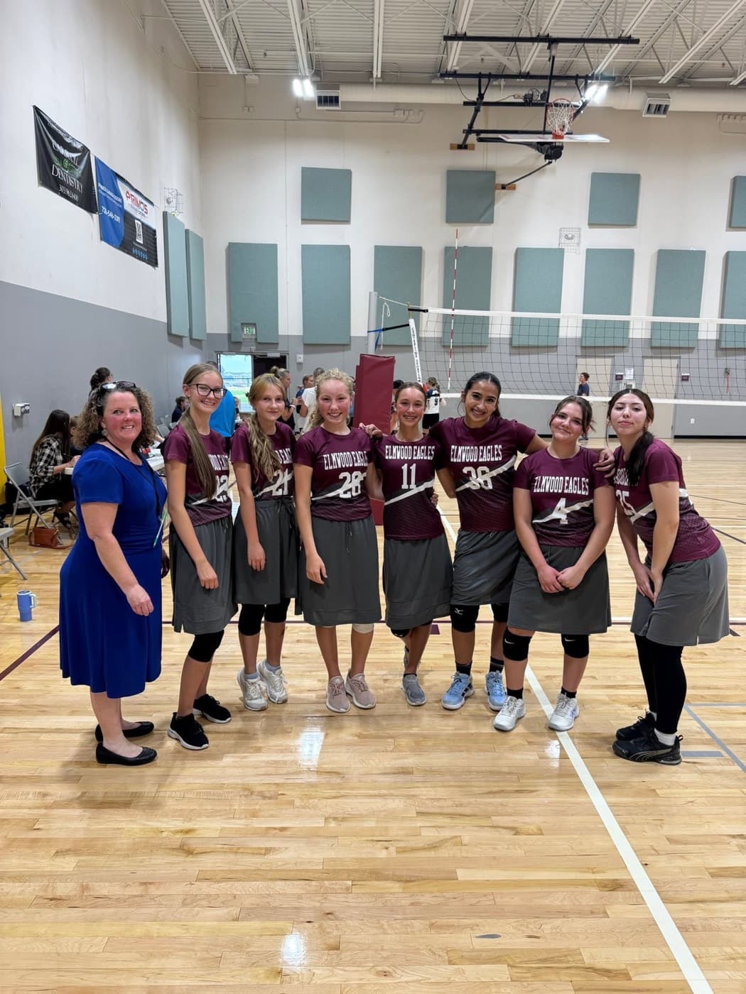 The Elmwood Eagles girls volleyball team with their coach